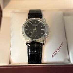 Wittnauer black dial dress watch with diamond accented bezel.